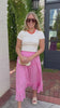 Lightweight pink midi skirt with gathered waist and ruffle hem styling