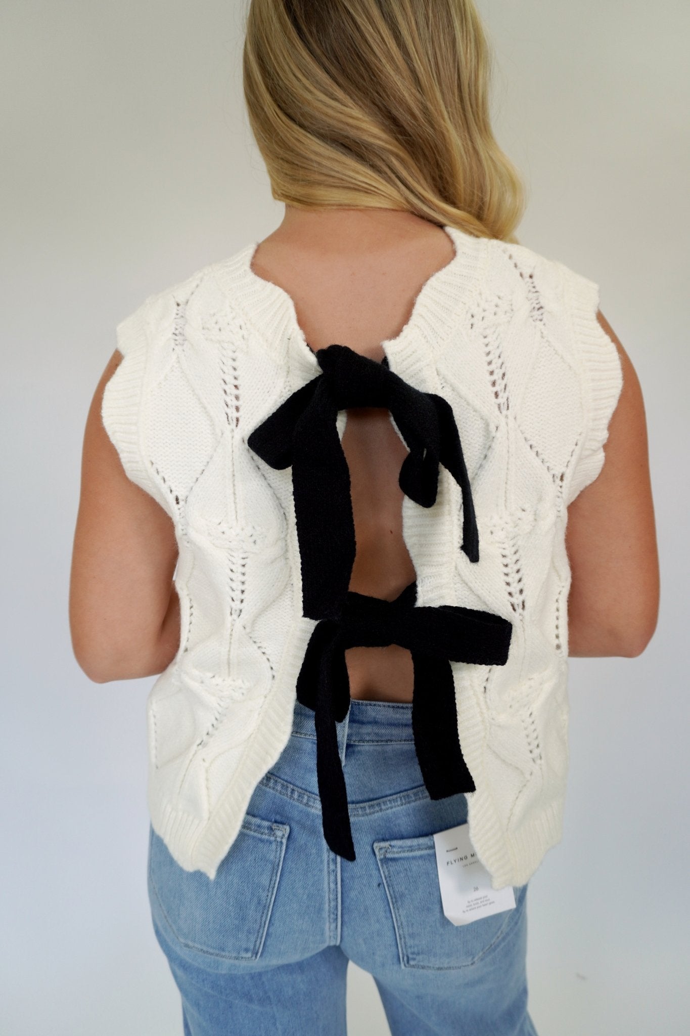 White Knit Sweater Vest with Black Bow Back - Anderson Ave boutique
