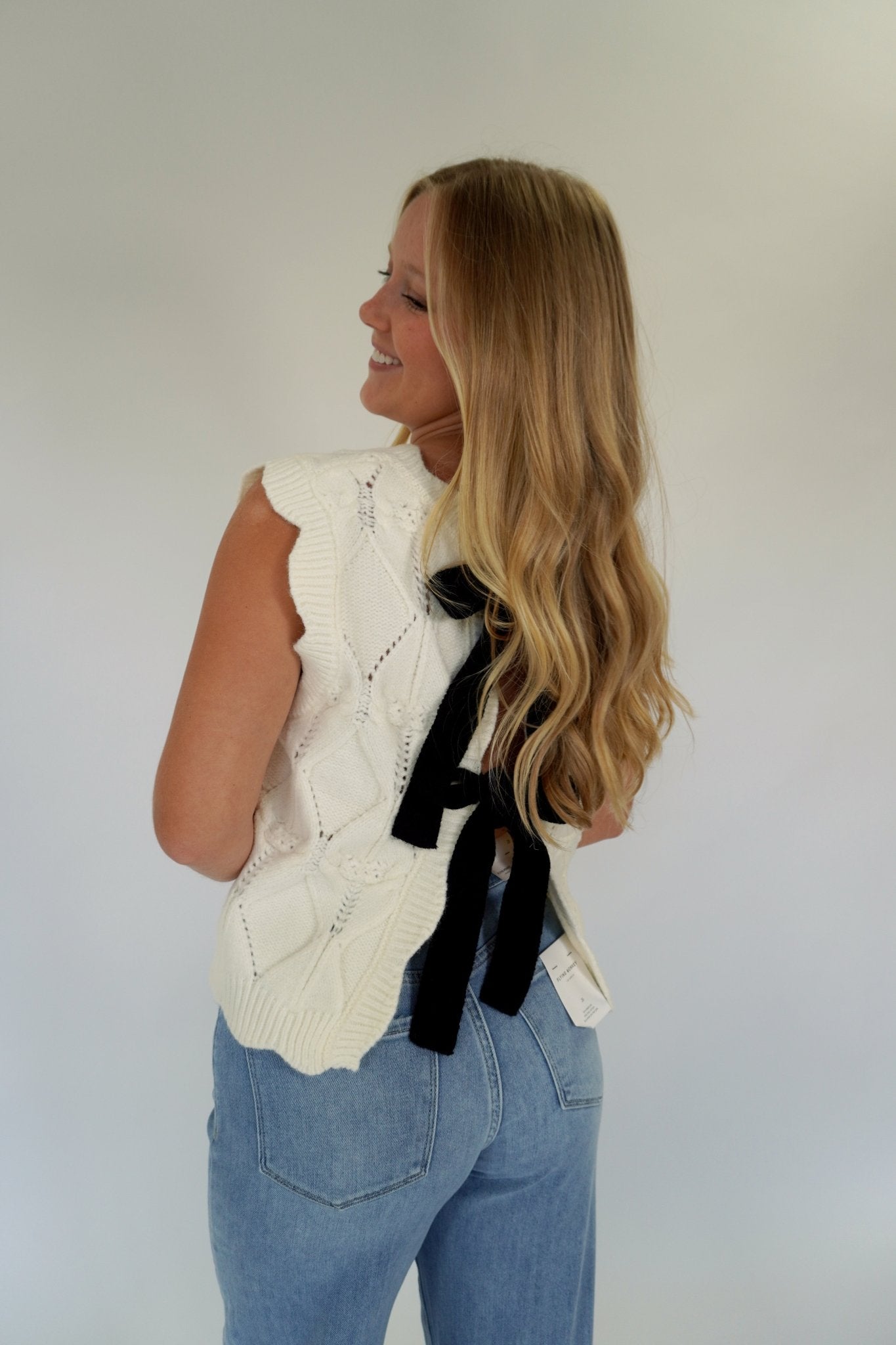 White Knit Sweater Vest with Black Bow Back - Anderson Ave boutique